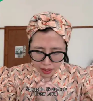 Asian Woman Praying in Zulu: 